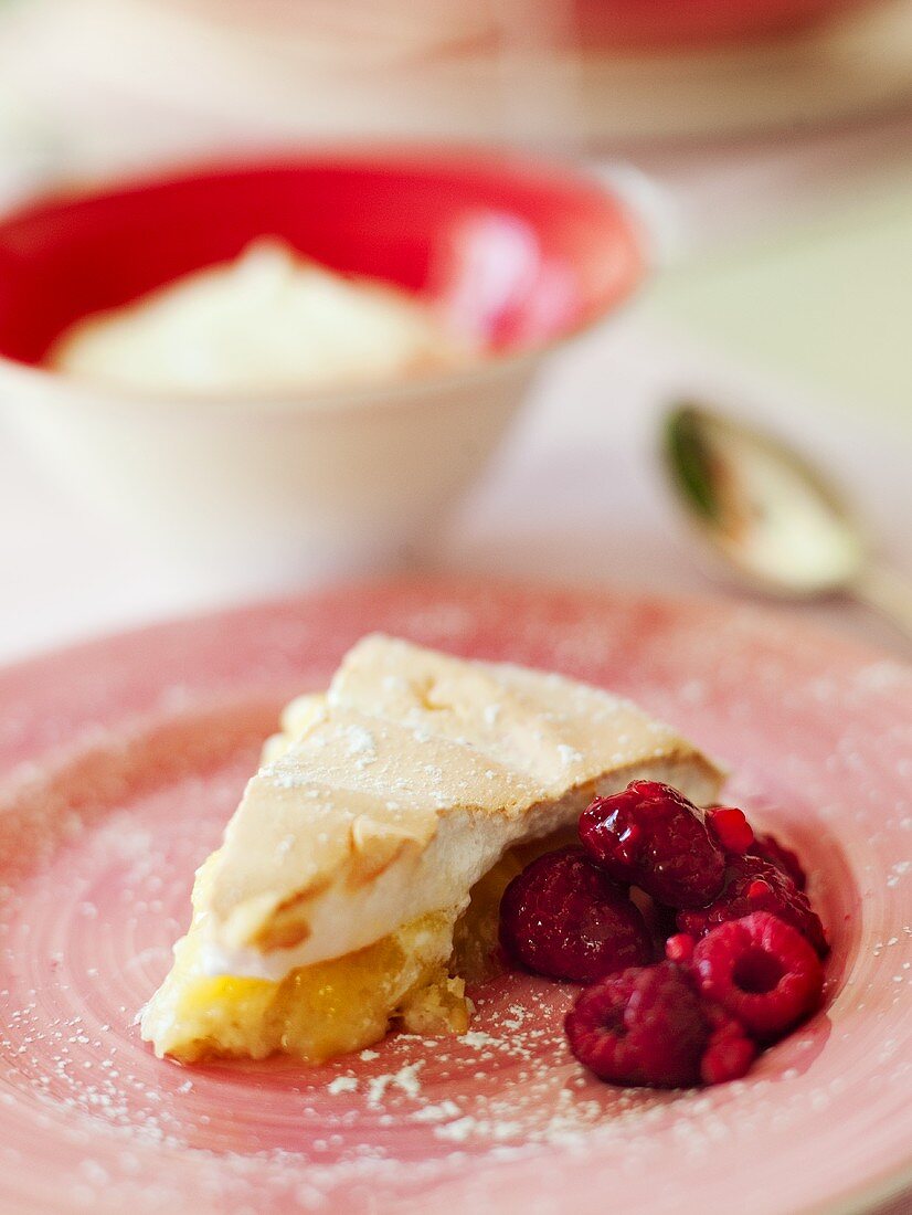 Lemon meringue pie and raspberries