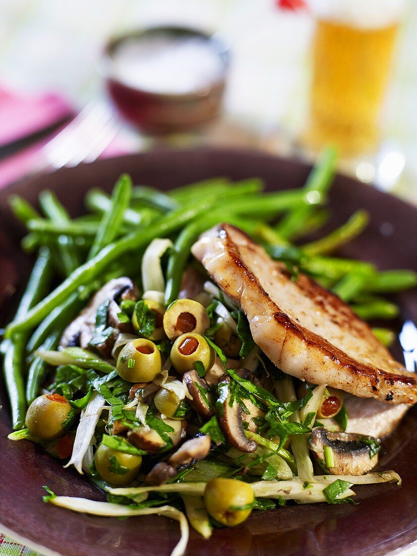 Pork chop stuffed with fennel, mushrooms and olives