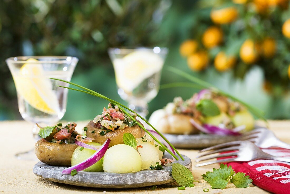 Stuffed mushrooms with a melon salad