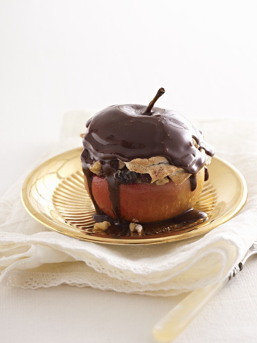 A baked apple with a gingerbread filling and a chocolate topping
