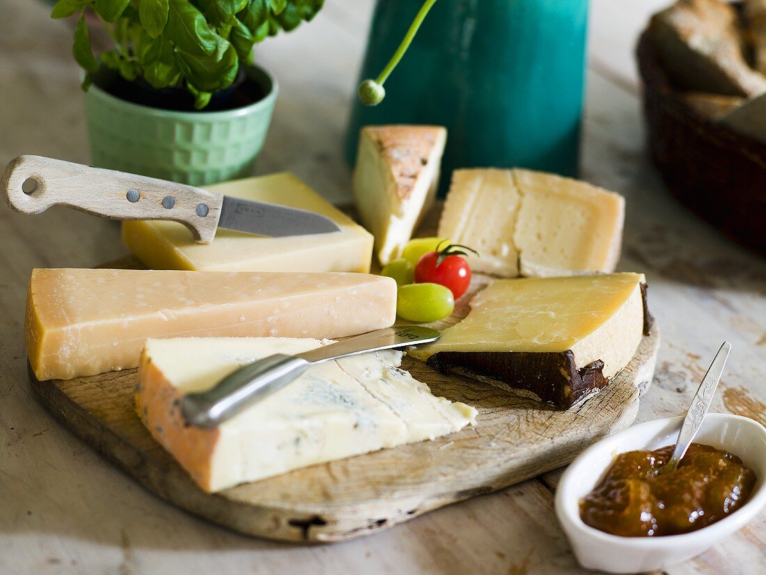 A mixed cheese platter with fig jam