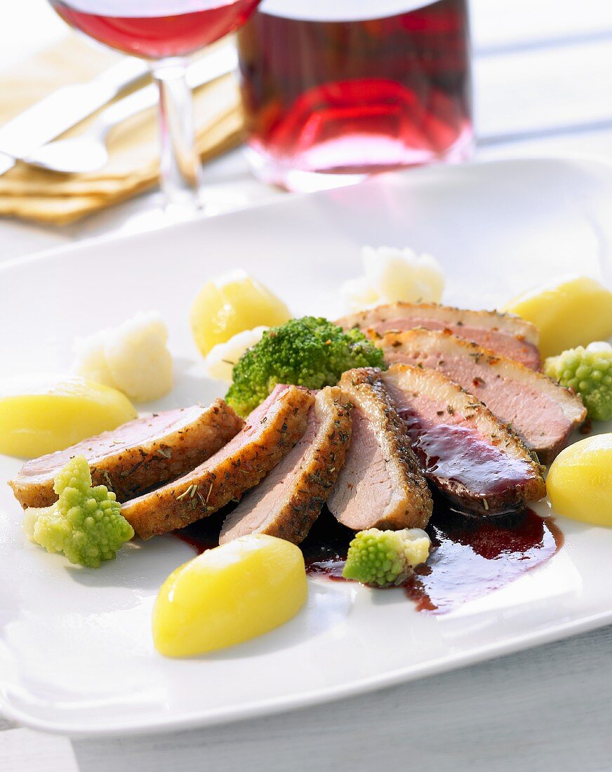 Roasted duck breast with potatoes and steamed vegetables