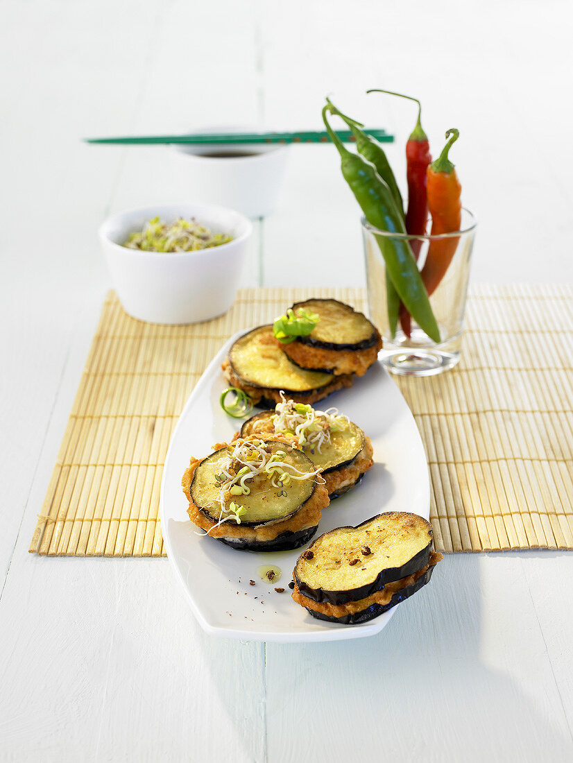 Aubergine slices filled with chicken breast, sprouts
