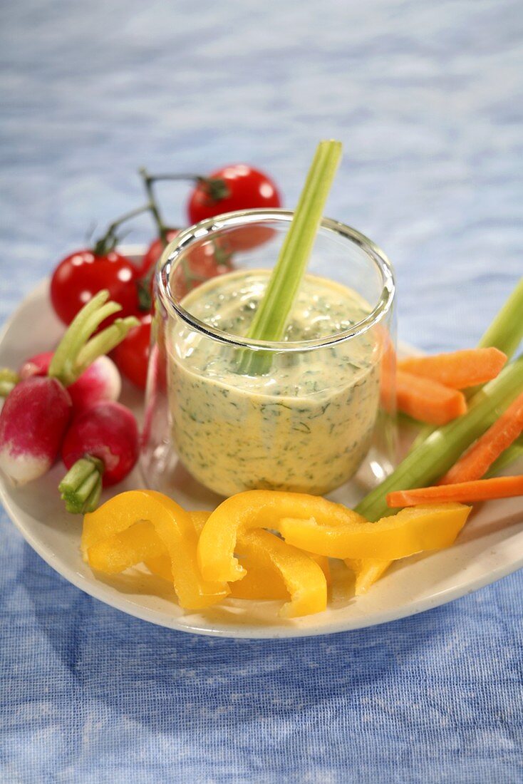 Mixed vegetables with a glass of herb dip