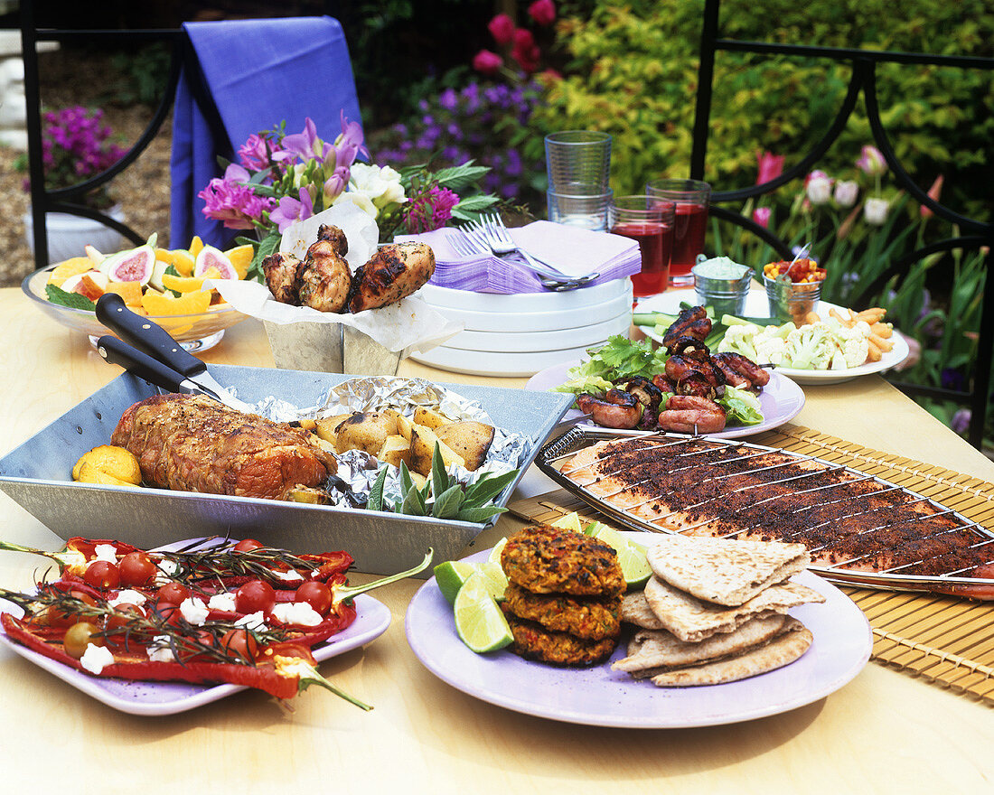A selection of grilled dishes on a table out of doors