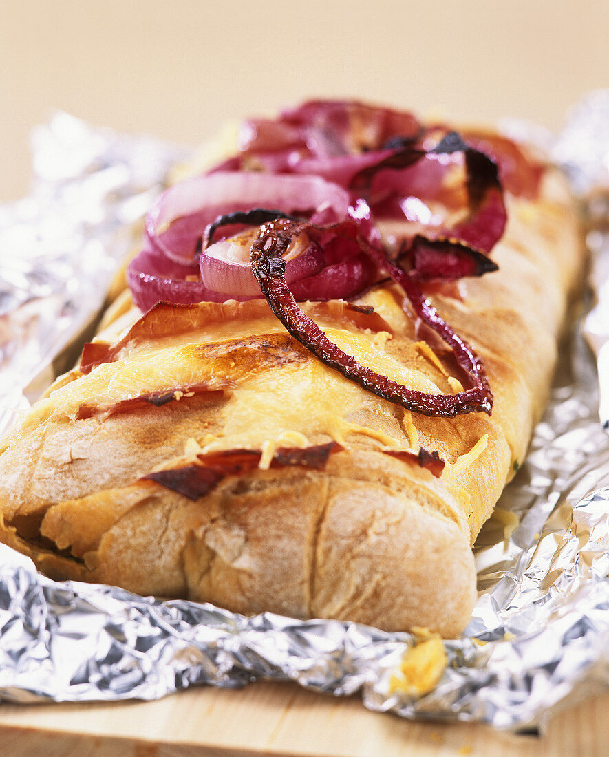 Baked ciabatta filled with ham, cheese and onions