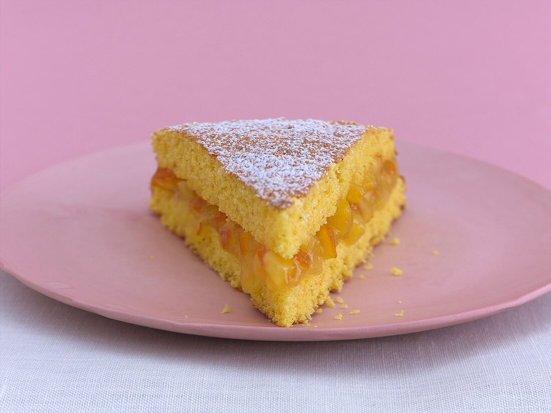 A piece of polenta cake with orange filling