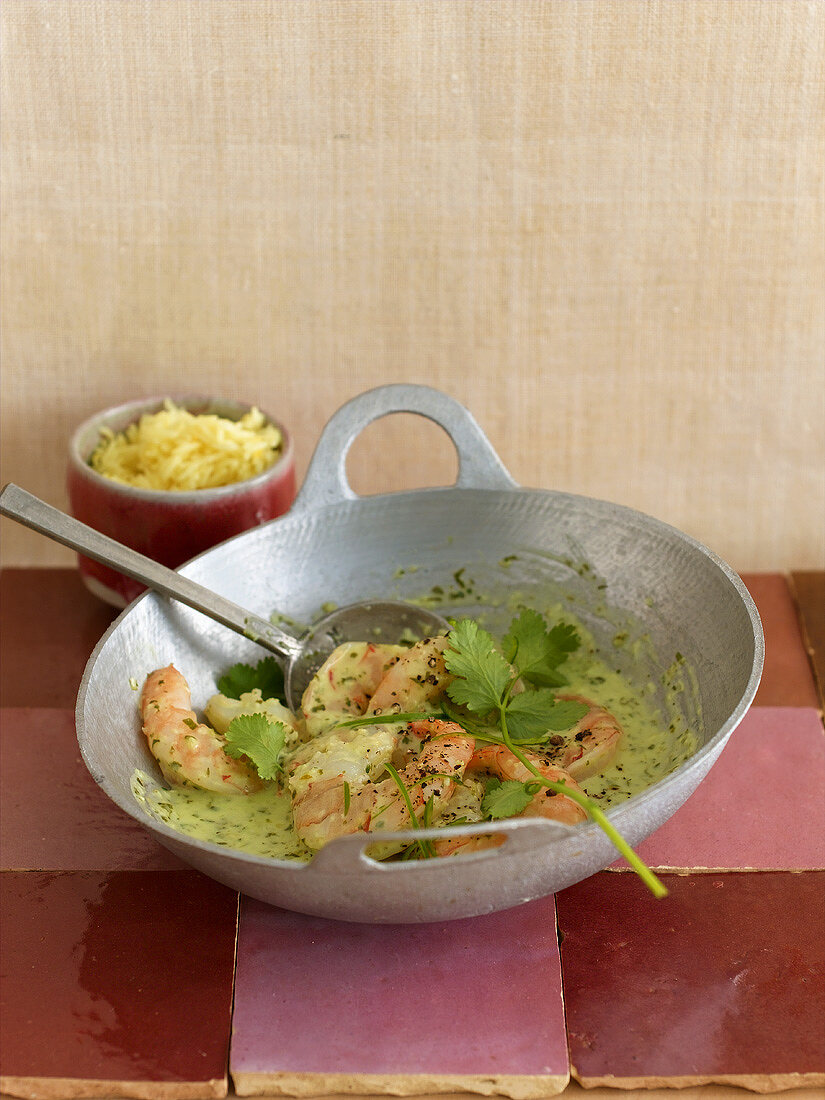 Prawns in coriander and coconut sauce in a wok