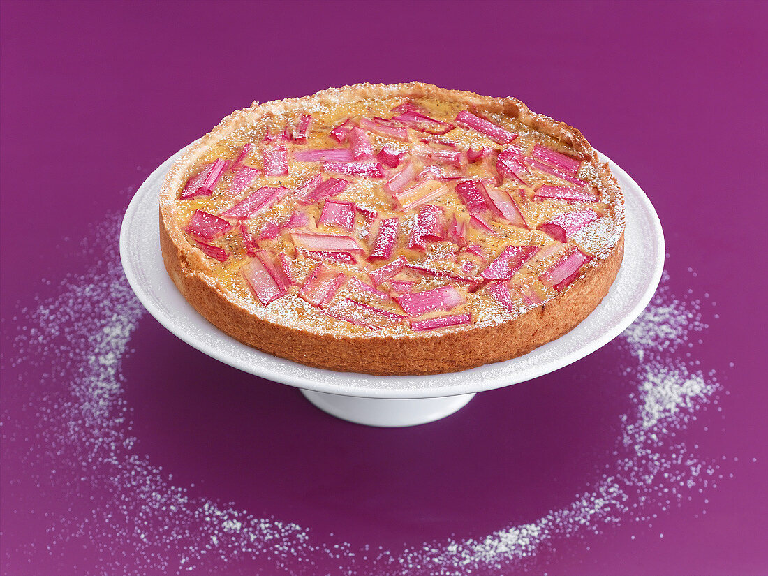 A rhubarb cake on a cake stand