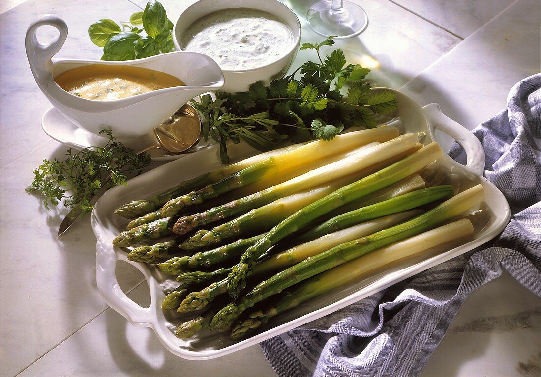Green asparagus with various sauces