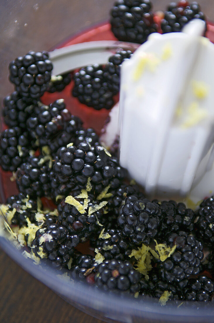 Blackberries with lemon zest in a food processor