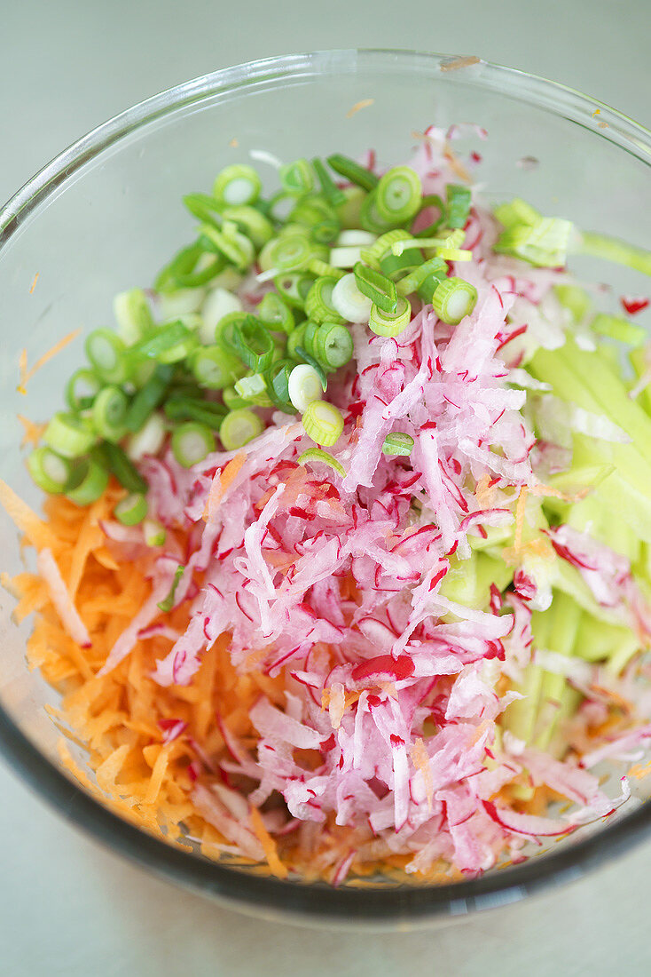 Grated vegetables in a dish to be used as wrap filling