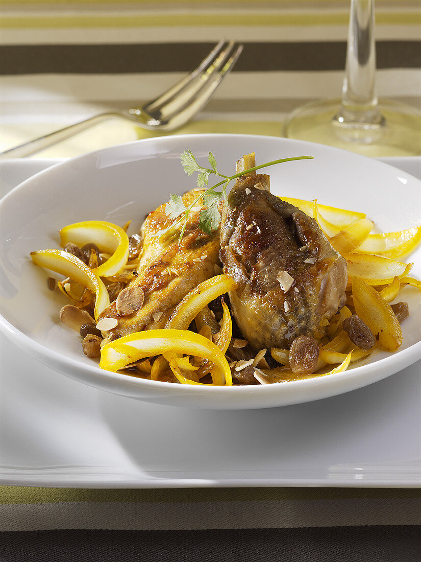 Guinea fowl with onions cooked in a tajine