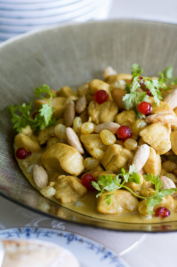 Chicken curry with raisins, almonds and pomegranate seeds