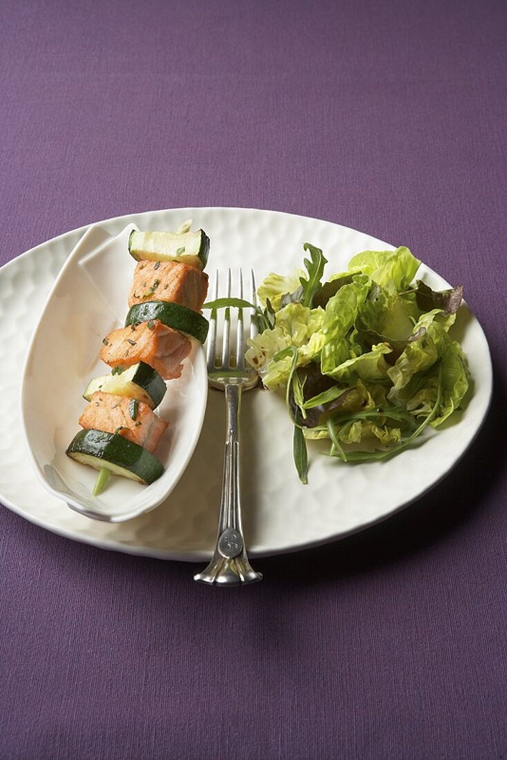 Salmon & courgette on lemon grass skewer with salad leaves