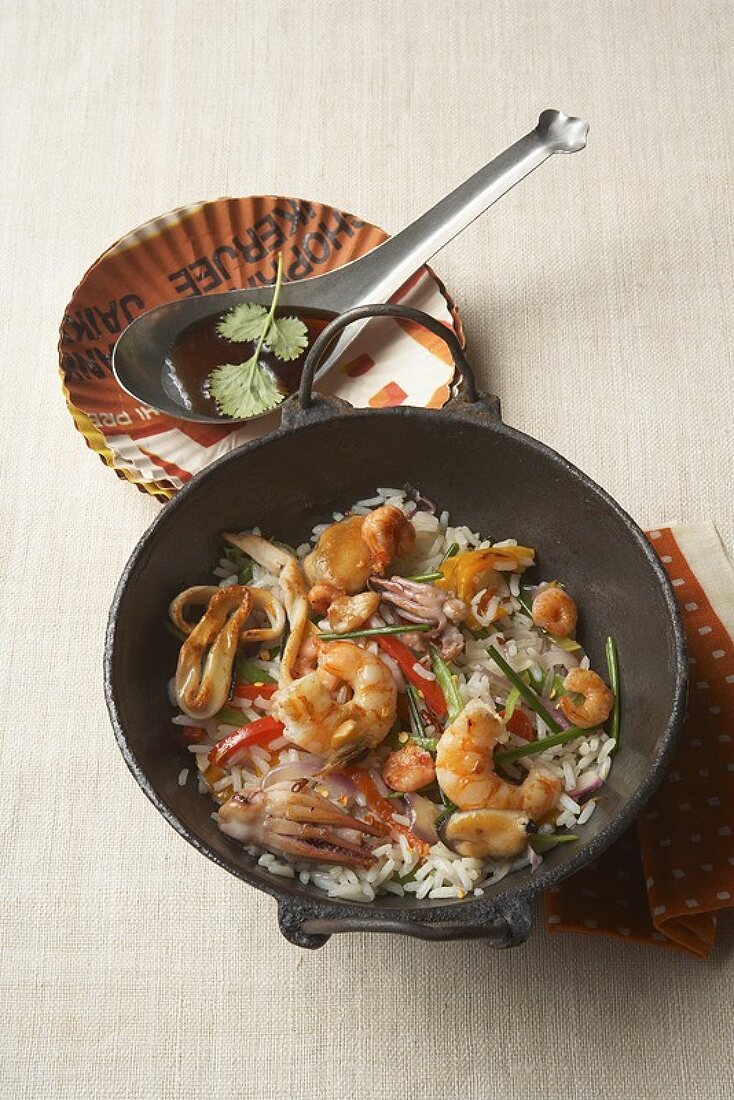 Seafood stir-fry with jasmine rice, mangetout and peppers
