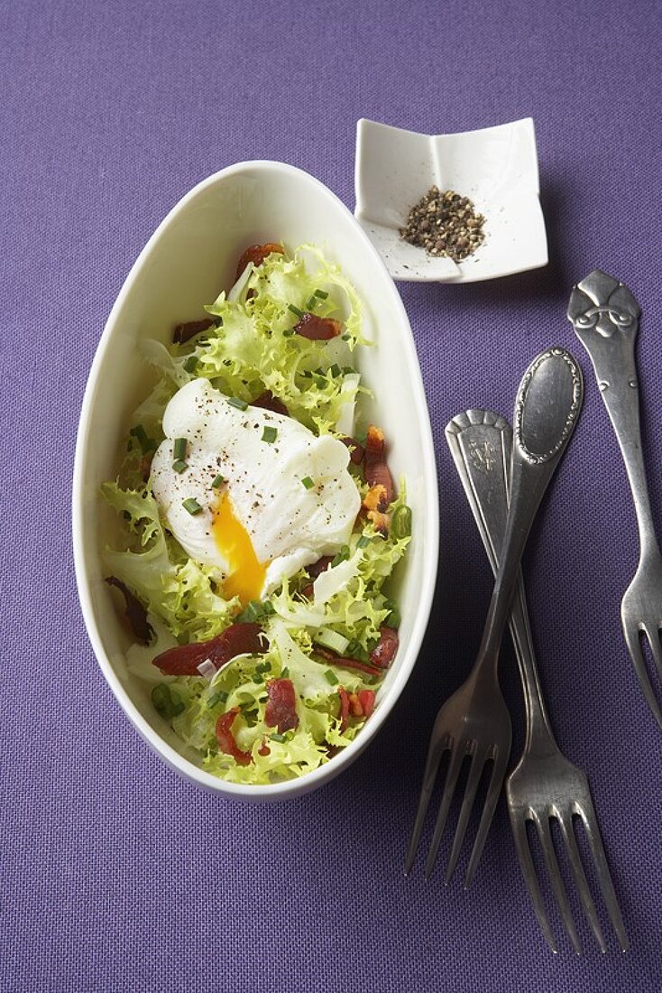 Frisée with bacon and poached egg