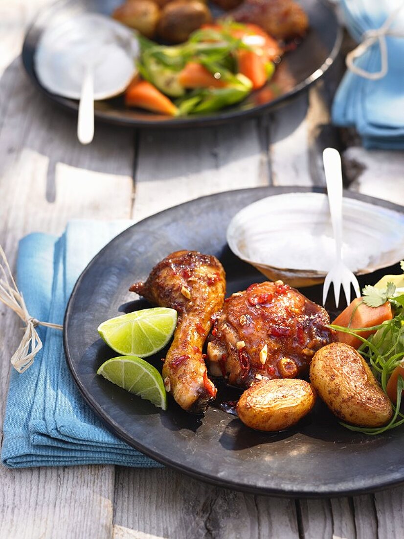 Marinated, baked chicken pieces with potatoes out of doors