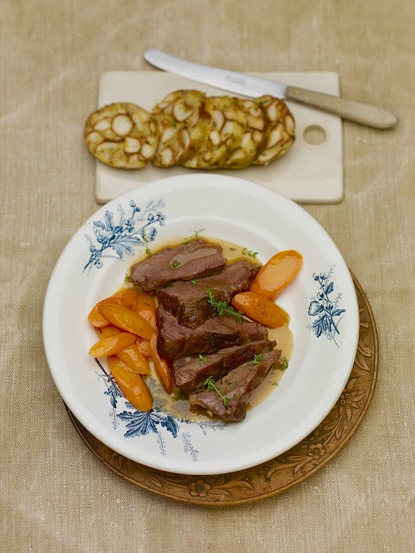 Braised veal cheeks with carrots and pretzel dumpling