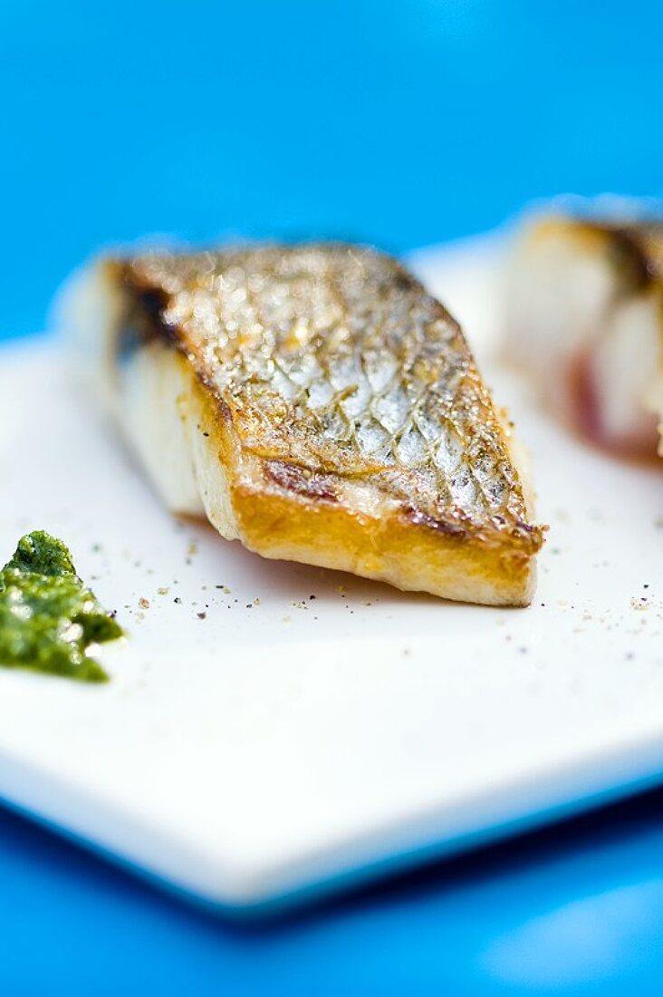 Fried sea bass with pesto