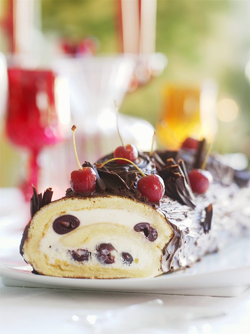 Chocolate-coated sponge roll with mascarpone & cherry cream