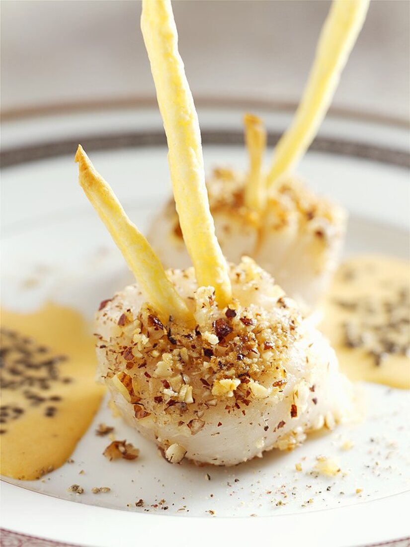 Fried scallops with hazelnuts and truffle sauce
