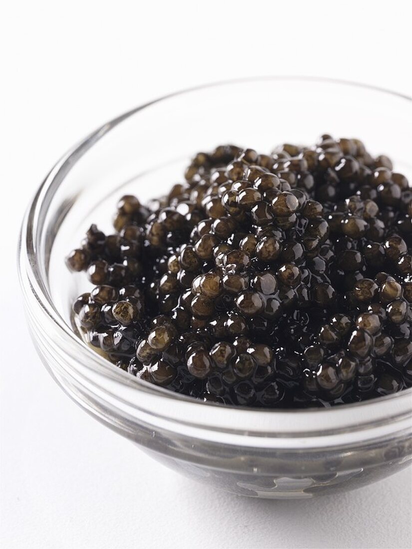 A small glass dish of caviar
