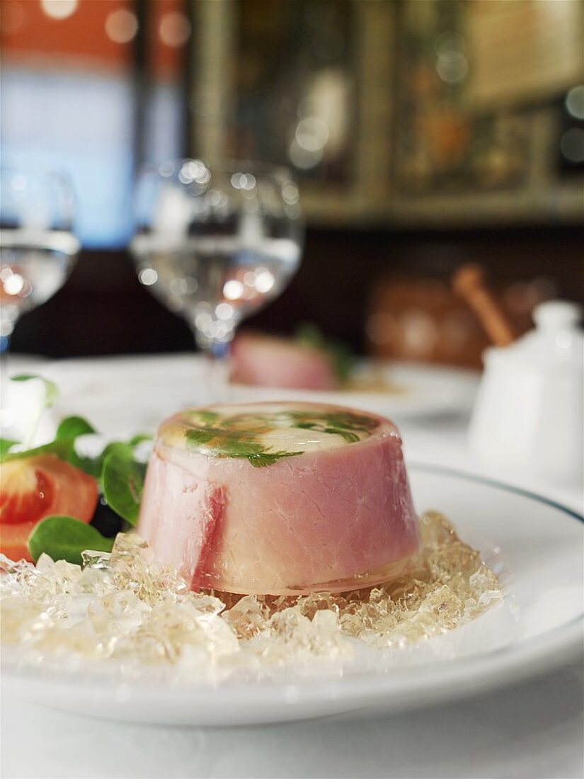 Egg in aspic with ham in a restaurant