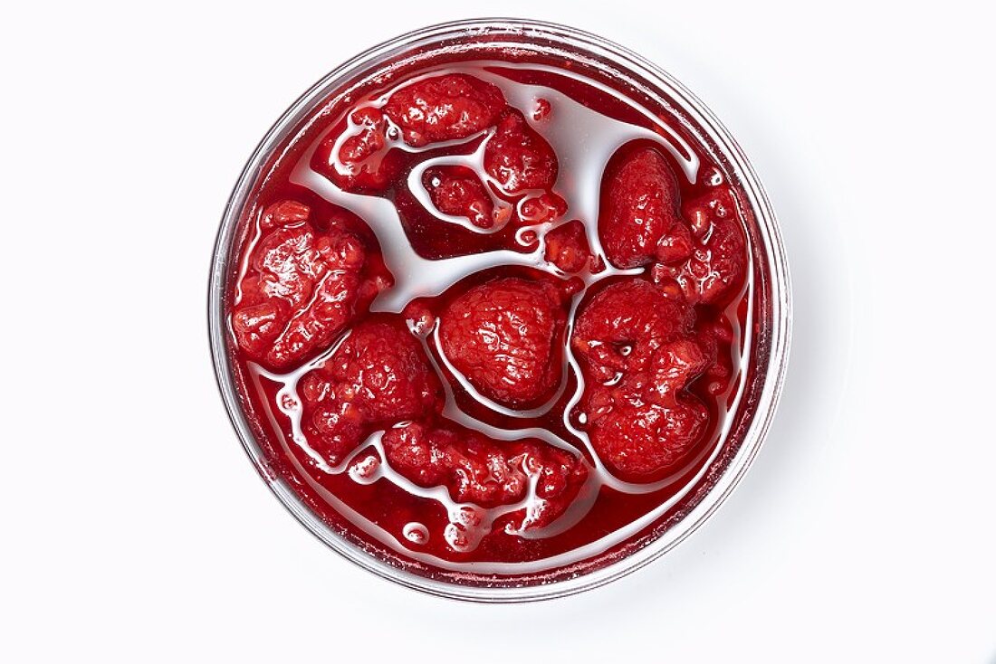 Preserved raspberries in a jar