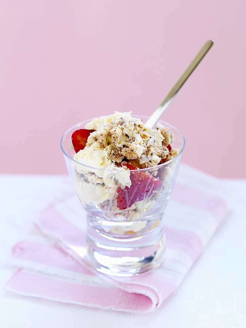 Whipped cream, meringue & strawberries in a schnapps glass