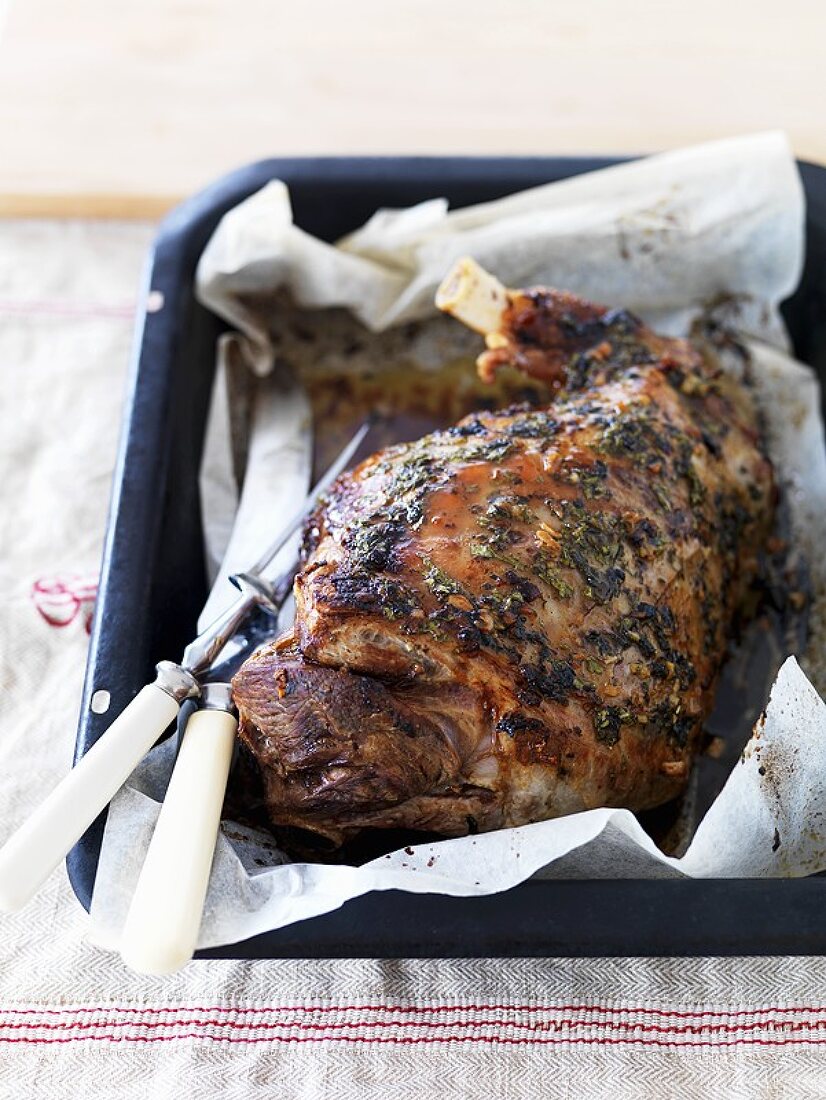 Roast leg of lamb in a roasting tin