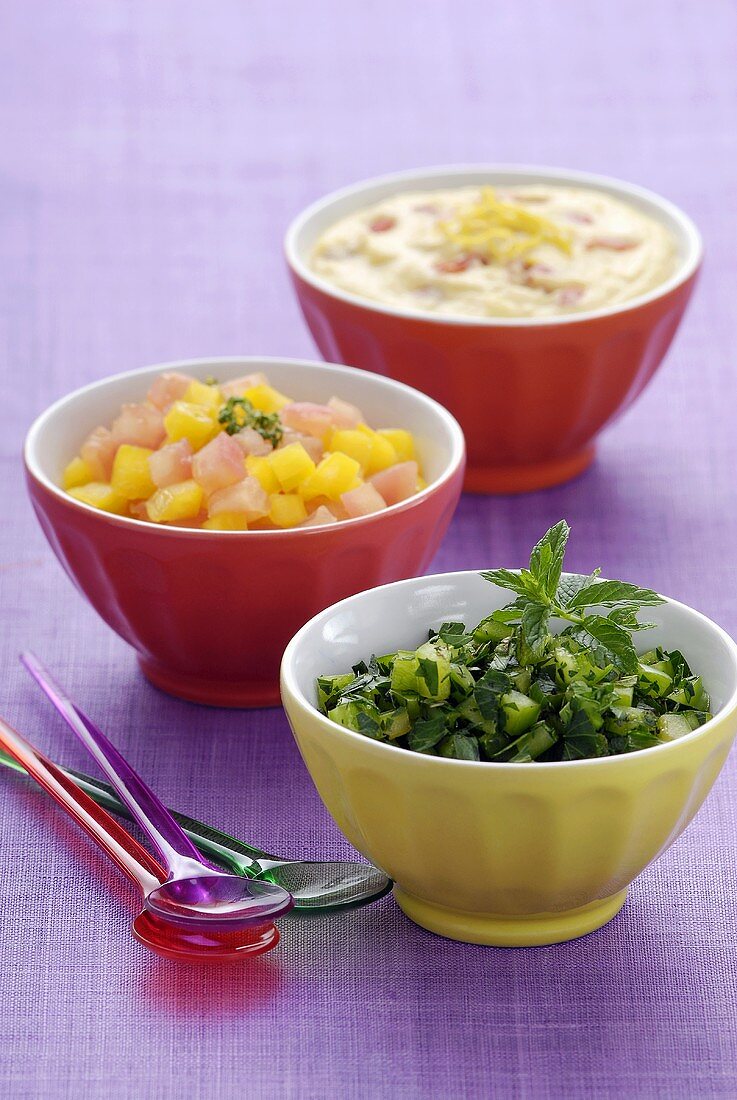 Three different salads in bowls (Lebanon)