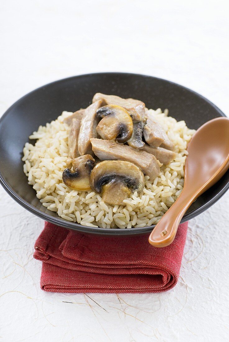 Strips of veal with mushrooms on rice