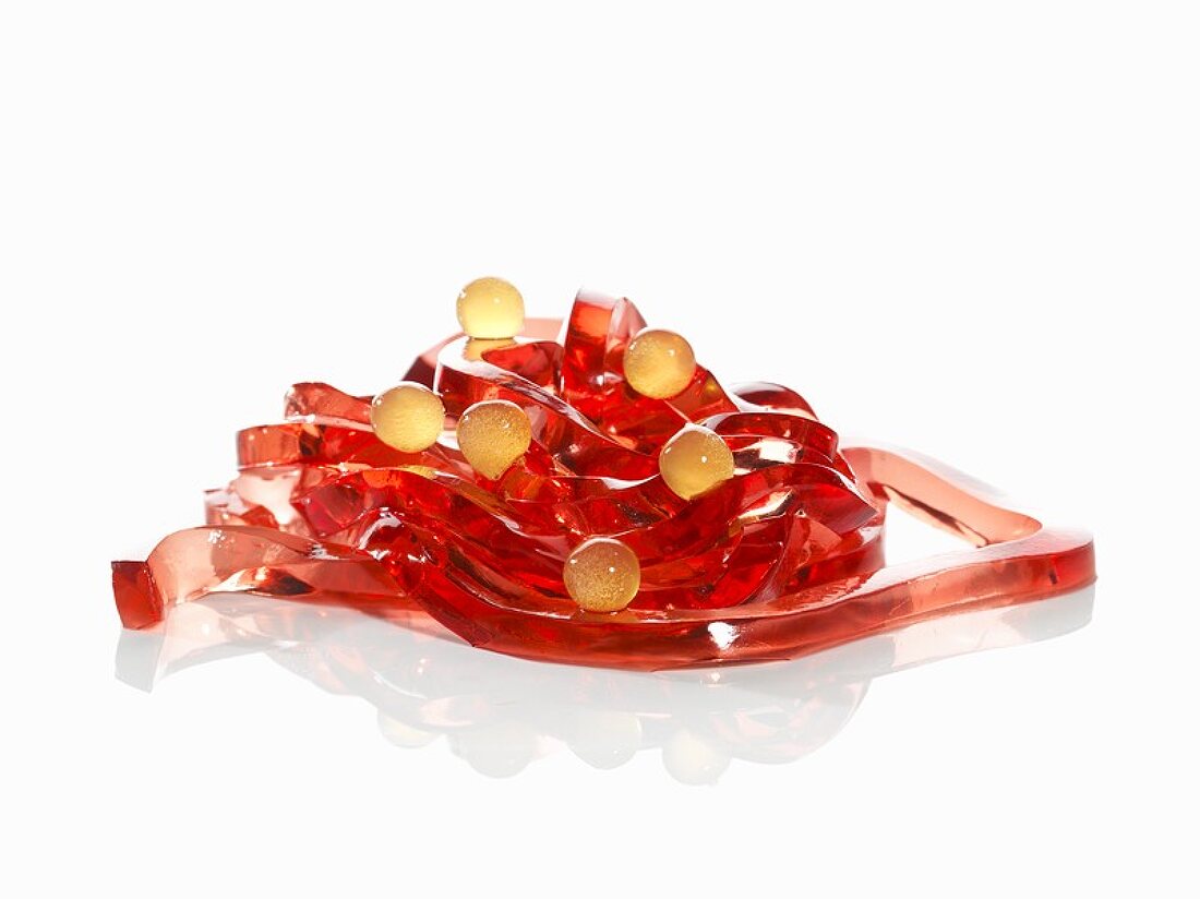 Molecular cuisine: Campari tagliatelle with orange juice spheres