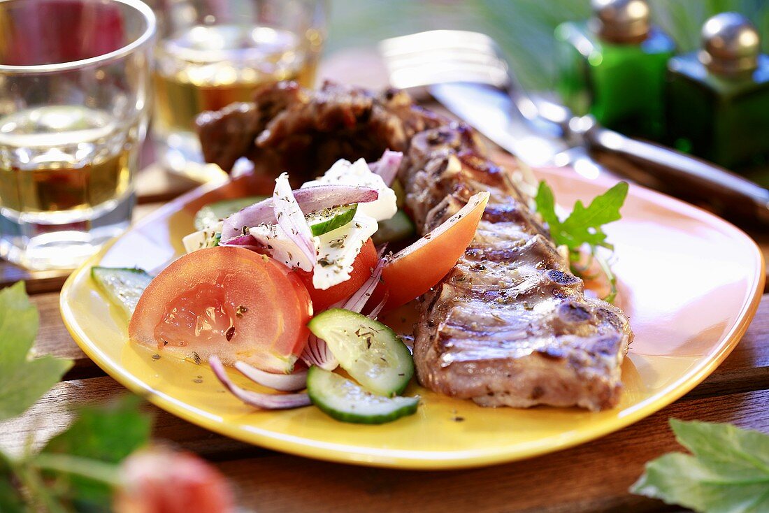 Grilled lamb ribs with salad