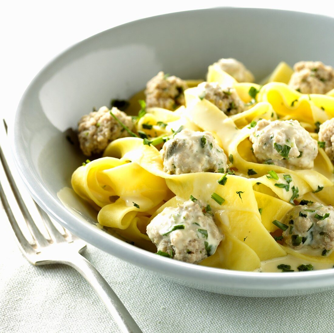 Veal meatballs with ribbon pasta in cream sauce