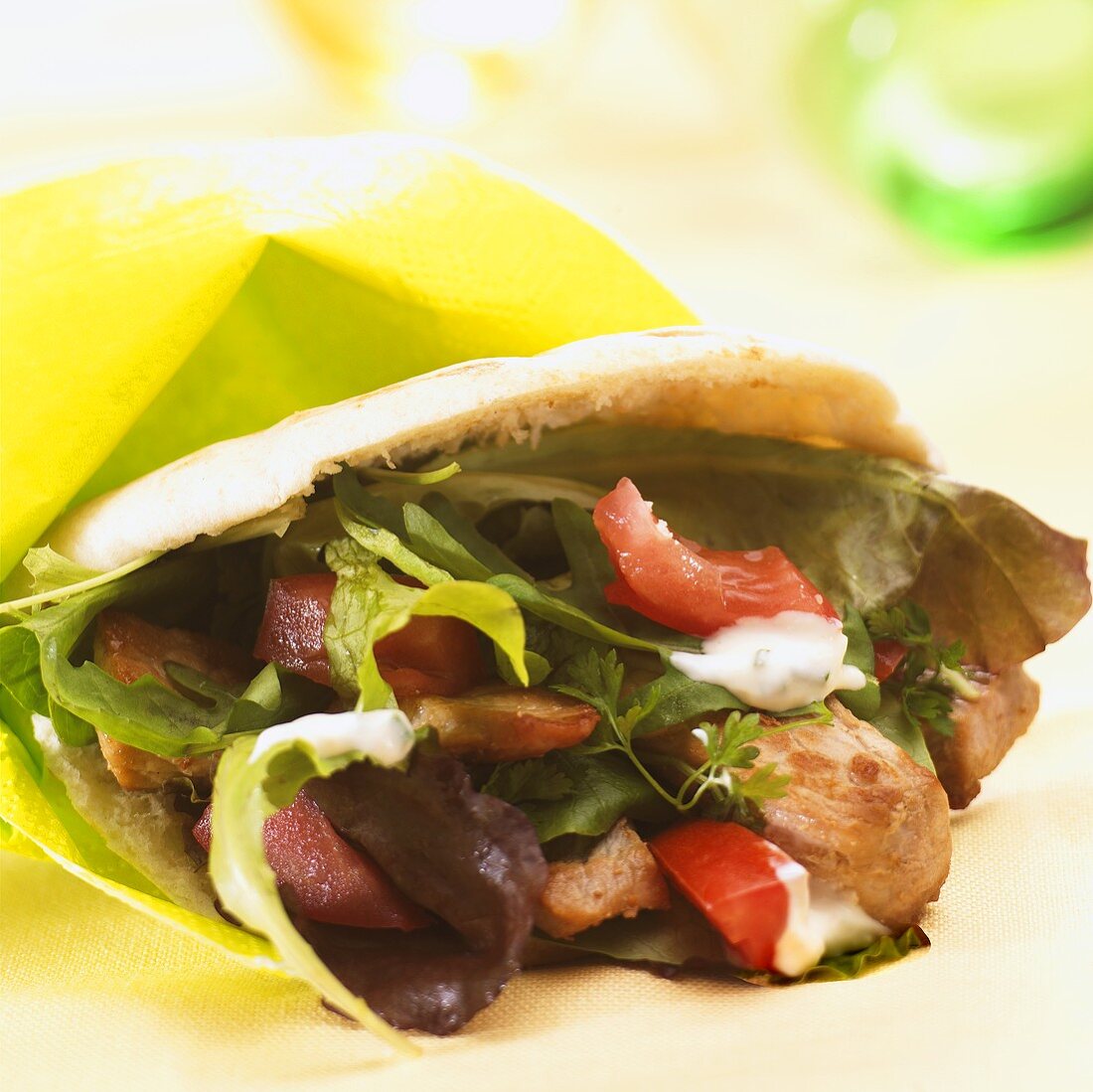 Roast pork and salad in pita bread