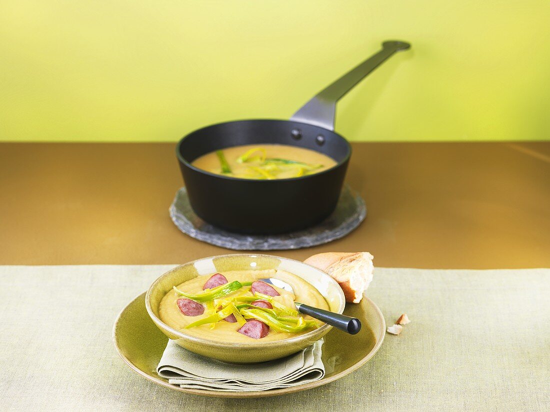 Yellow pea soup with sausage and leek