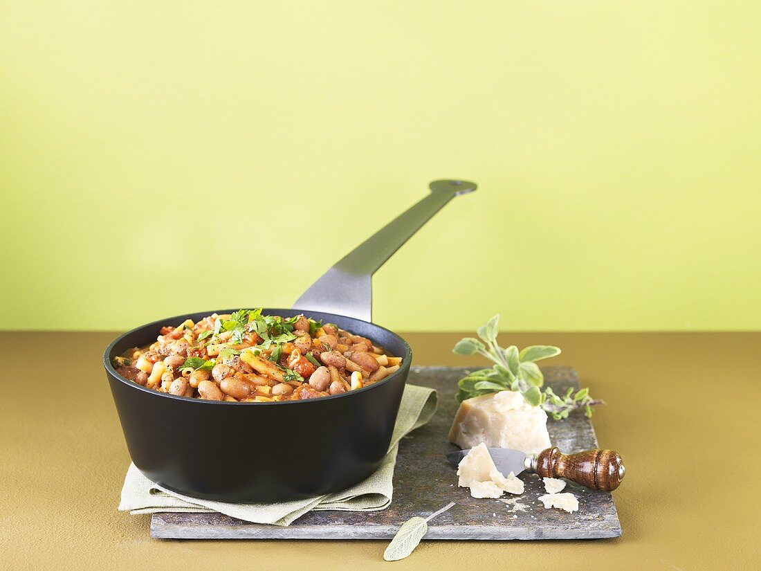 Bean stew with pasta and Parmesan