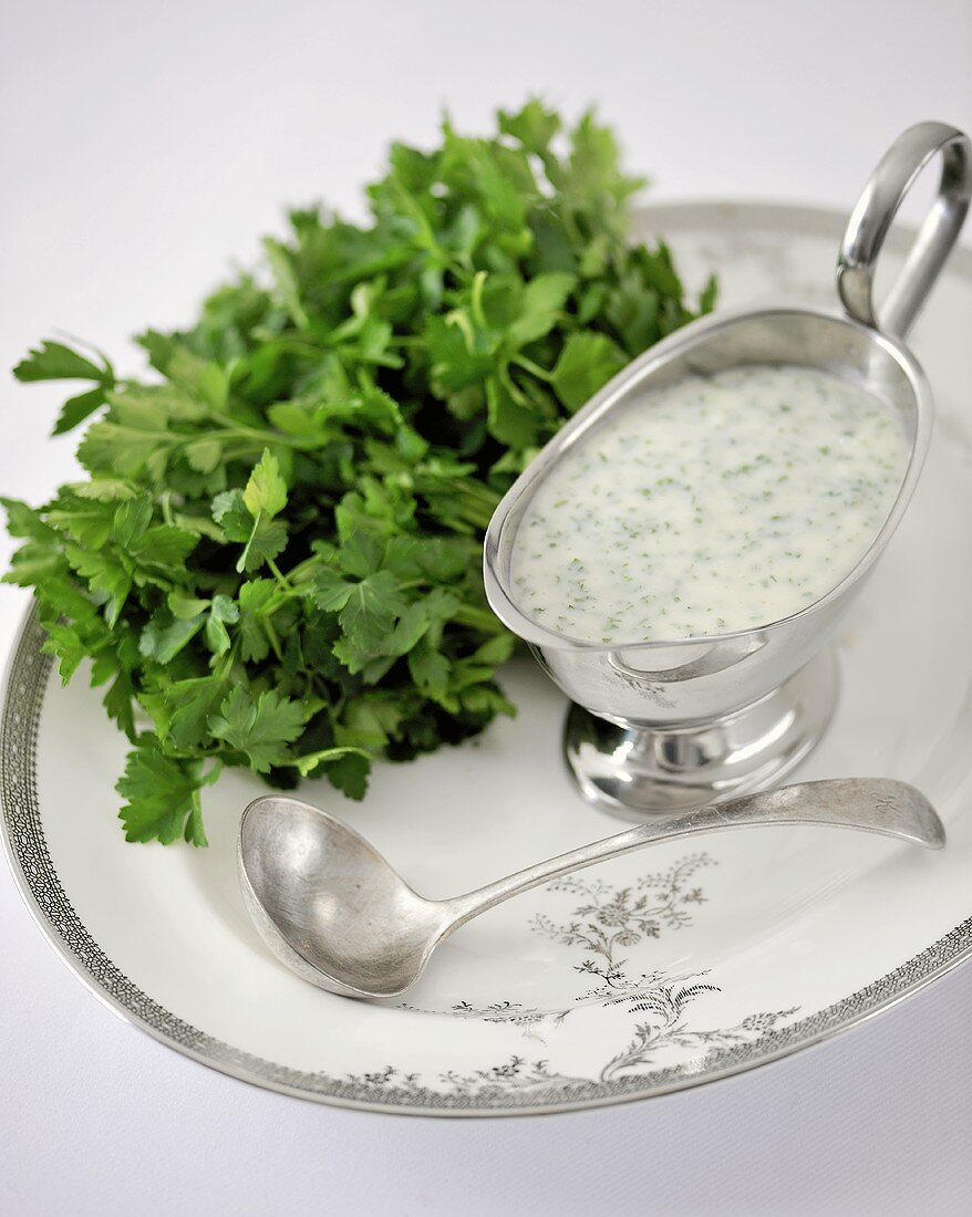 Parsley sauce in a sauce-boat with parsley