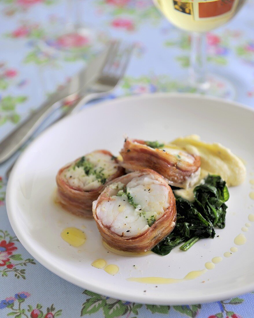Pancetta-wrapped monkfish with garlic and herb stuffing