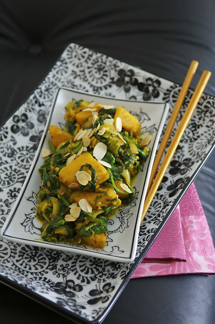 Pumpkin and spinach curry with almonds