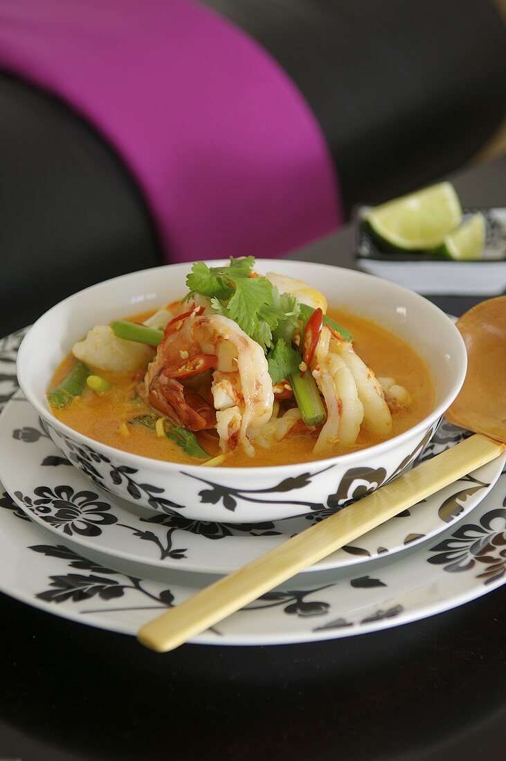 Curry coconut soup with noodles and prawns