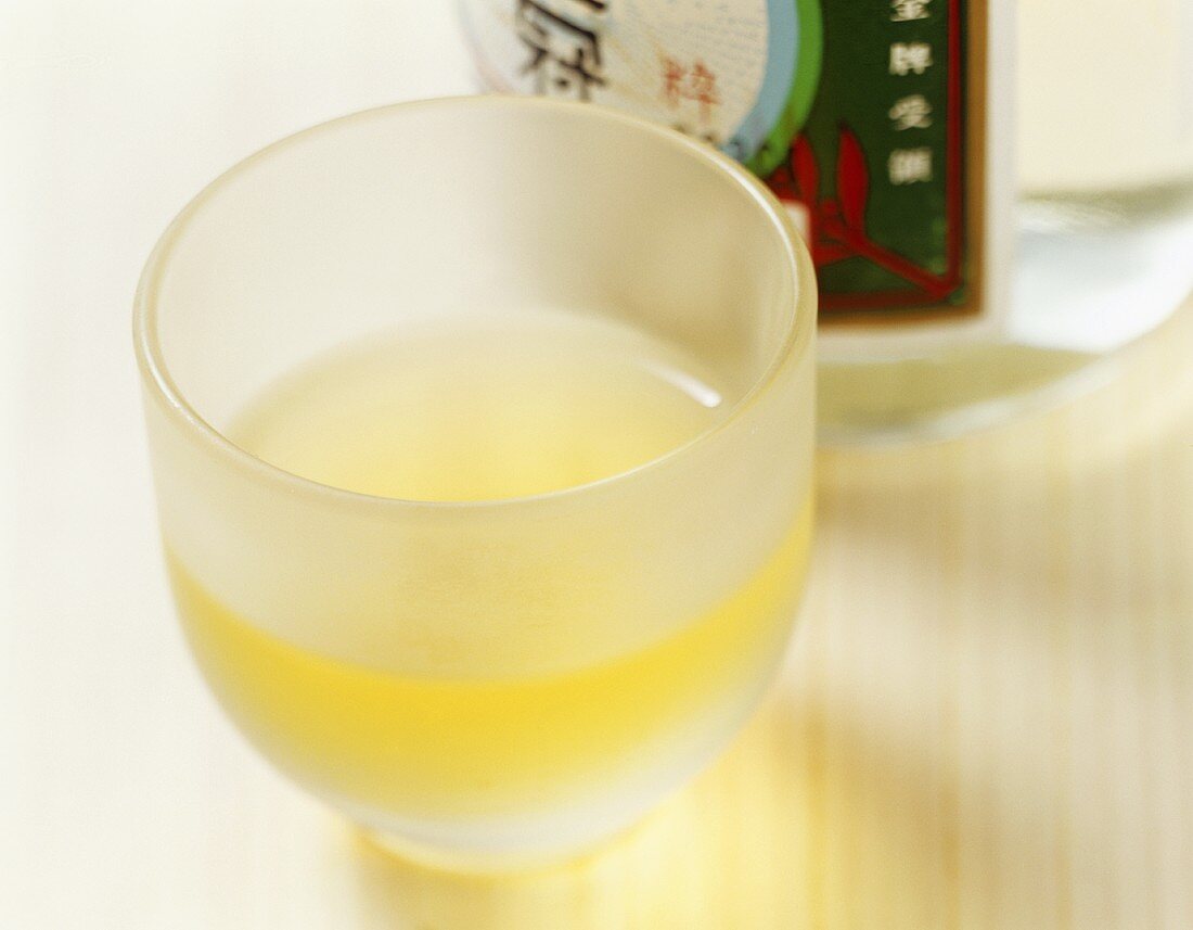 Rice wine in a bottle and a sake cup