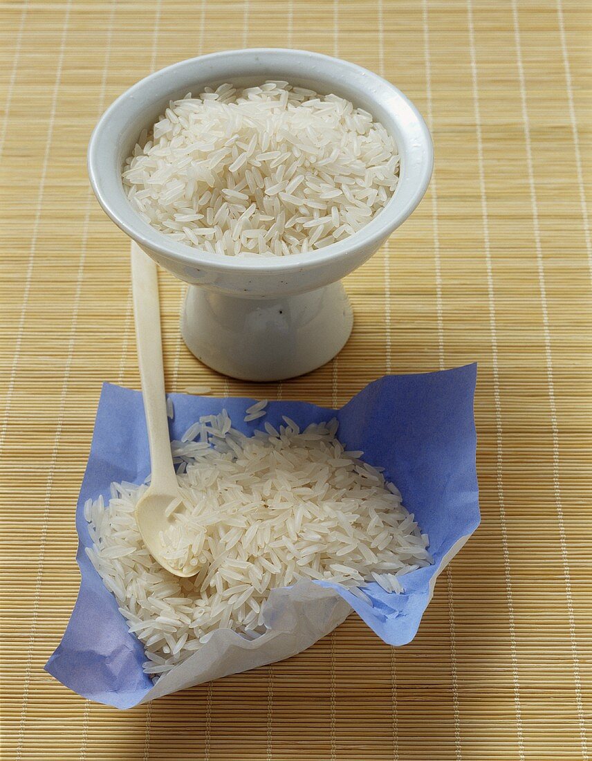 Fragrant rice and basmati rice in a bowl and on paper