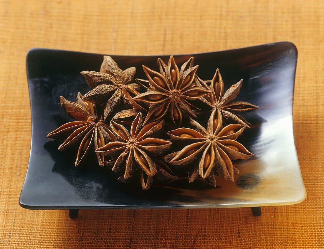 Several star anise in a dish