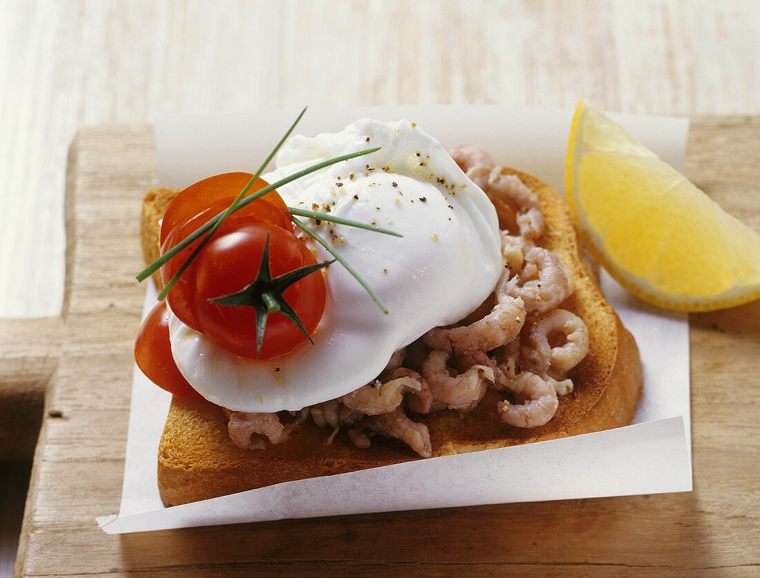 Poached egg and shrimps on toast