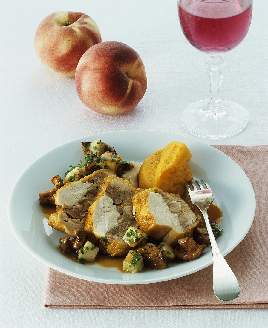 Capon with pumpkin puree on chanterelle and peach ragout
