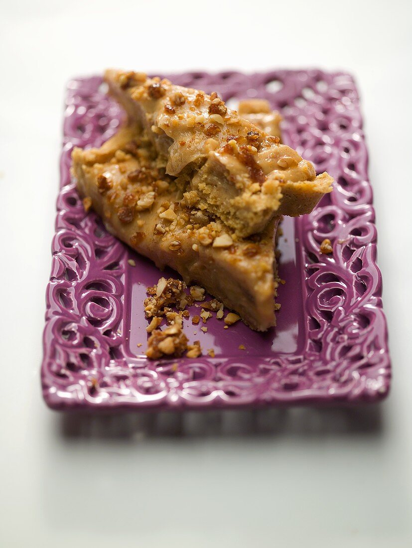 Two pieces of banana caramel pie on a ceramic plate