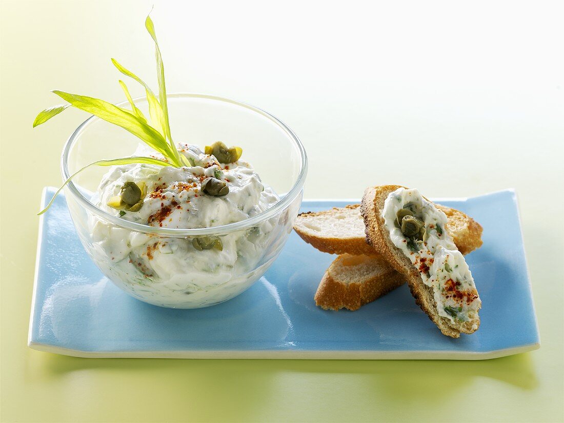 Toasted baguette and mayonnaise with herbs and capers